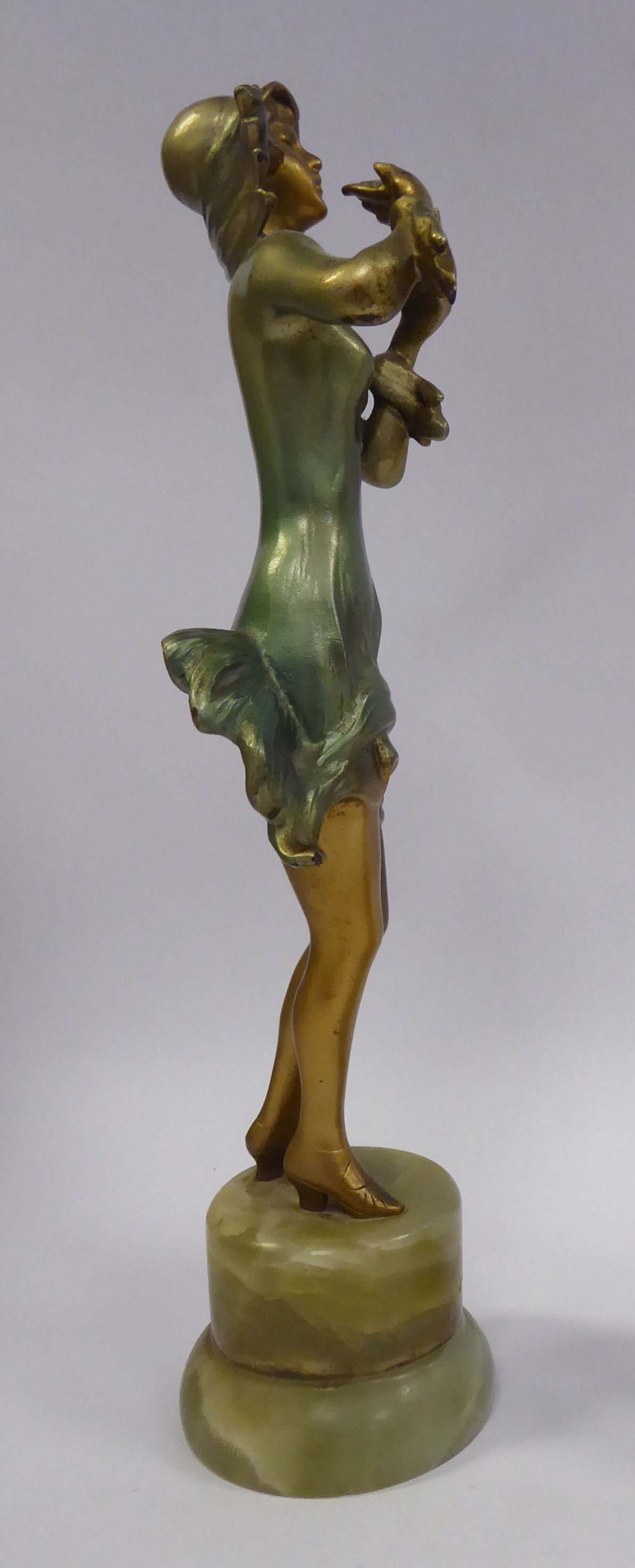 A late 1920s/early 1930s painted cold cast figure, a fashionable young woman, wearing a bonnet, - Image 4 of 4