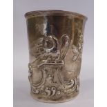 A silver coloured metal beaker, embossed with exotic birds,
