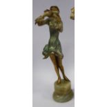 A late 1920s/early 1930s painted cold cast figure, a fashionable young woman, wearing a bonnet,