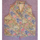 A mid 19thC silk lined gilet/waistcoat with a rolled collar and finely embroidered,