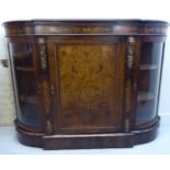 A late Victorian walnut credenza with figured and satinwood marquetry ornament and cast gilt metal