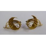 A pair of gold coloured metal scrolled earrings,