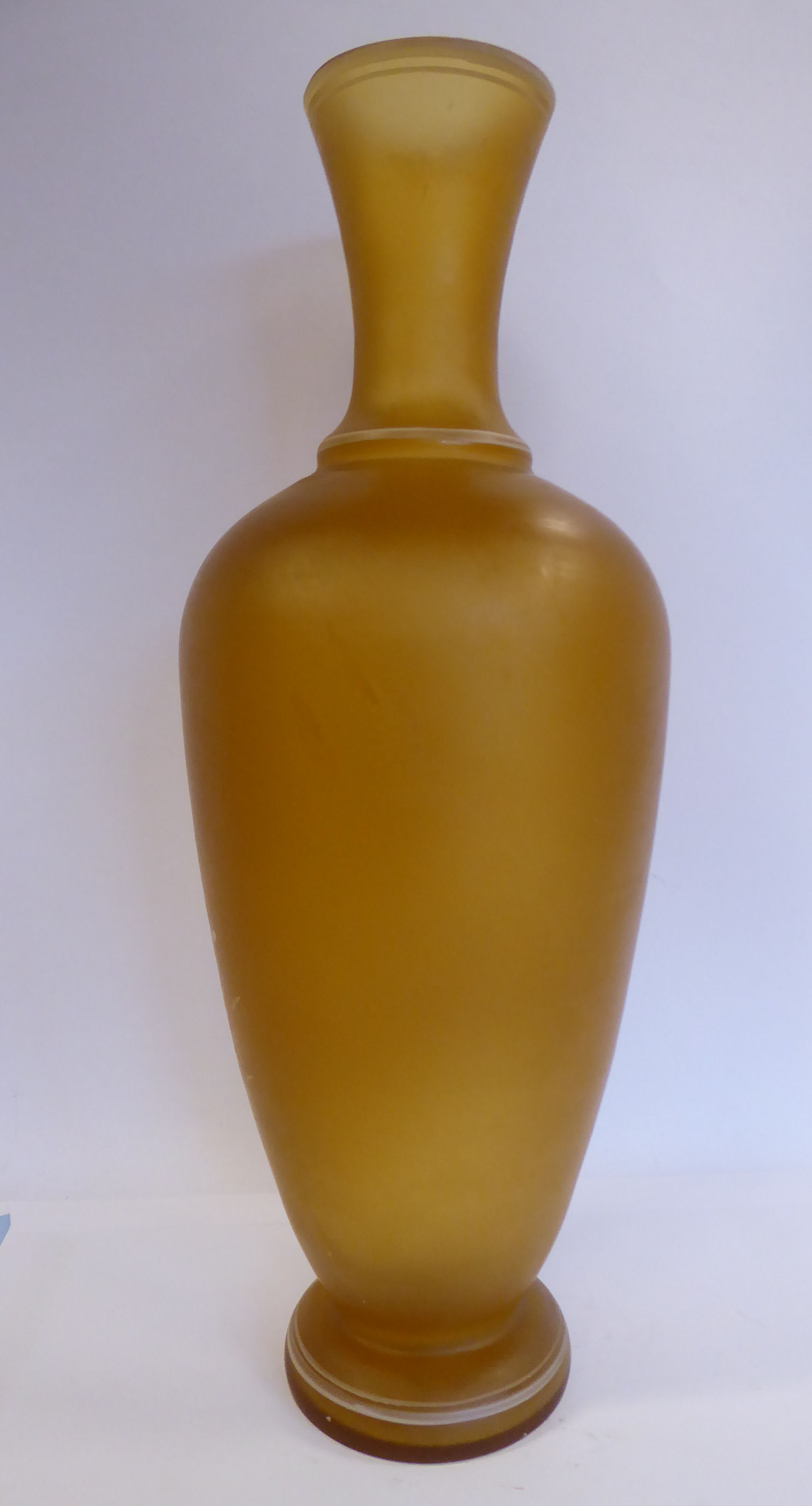 In the manner of Mary Gregory - a semi-opaque amber coloured glass vase of baluster form with a - Image 3 of 6