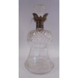 An Edwardian thistle design glass decanter with slice and diamond cut ornament and an applied,