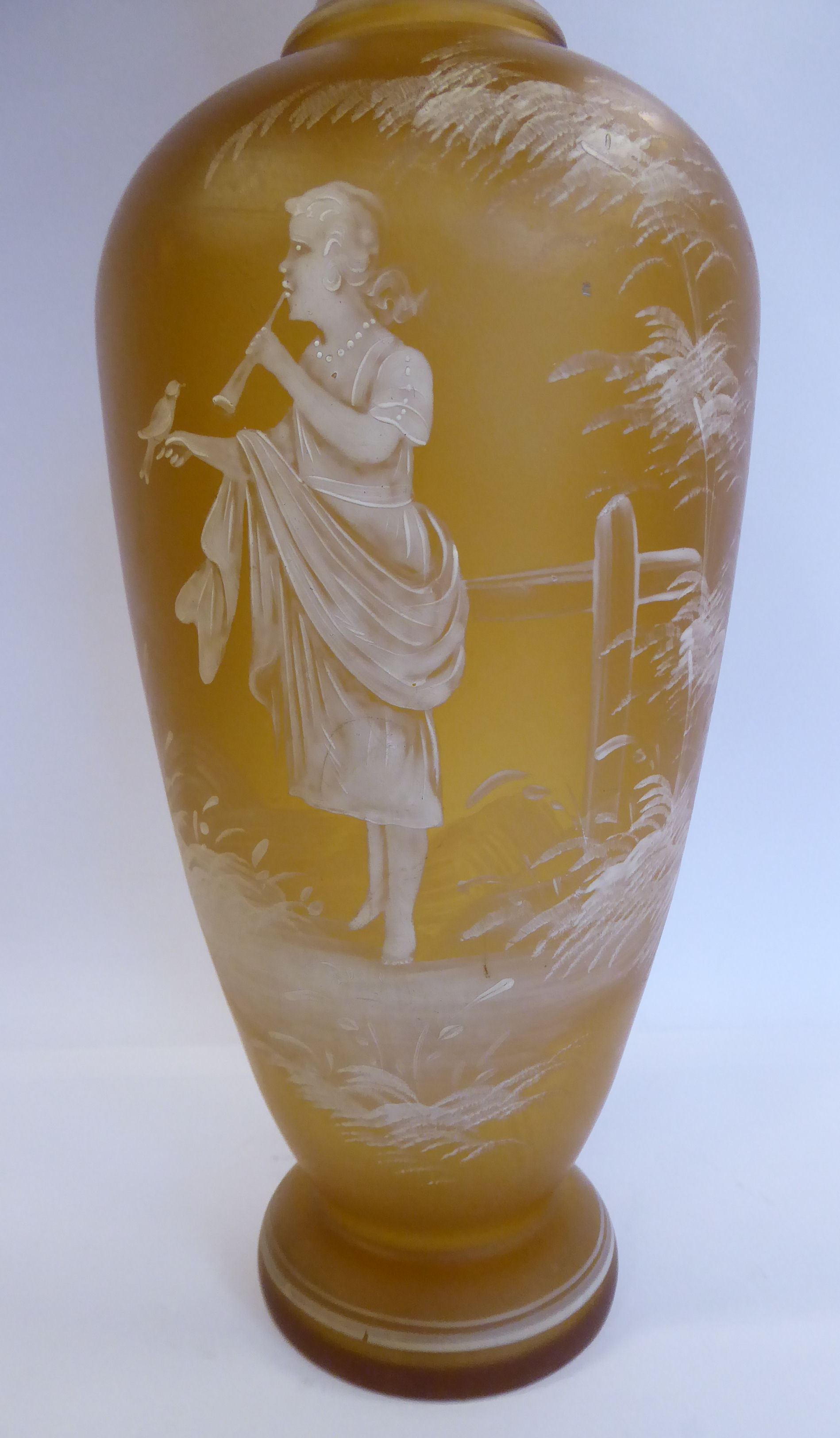 In the manner of Mary Gregory - a semi-opaque amber coloured glass vase of baluster form with a - Image 4 of 6