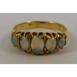 An 18ct gold five stone ring,