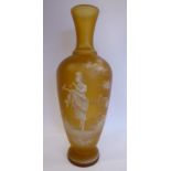 In the manner of Mary Gregory - a semi-opaque amber coloured glass vase of baluster form with a