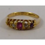 An 18ct gold claw set ruby and diamond ring