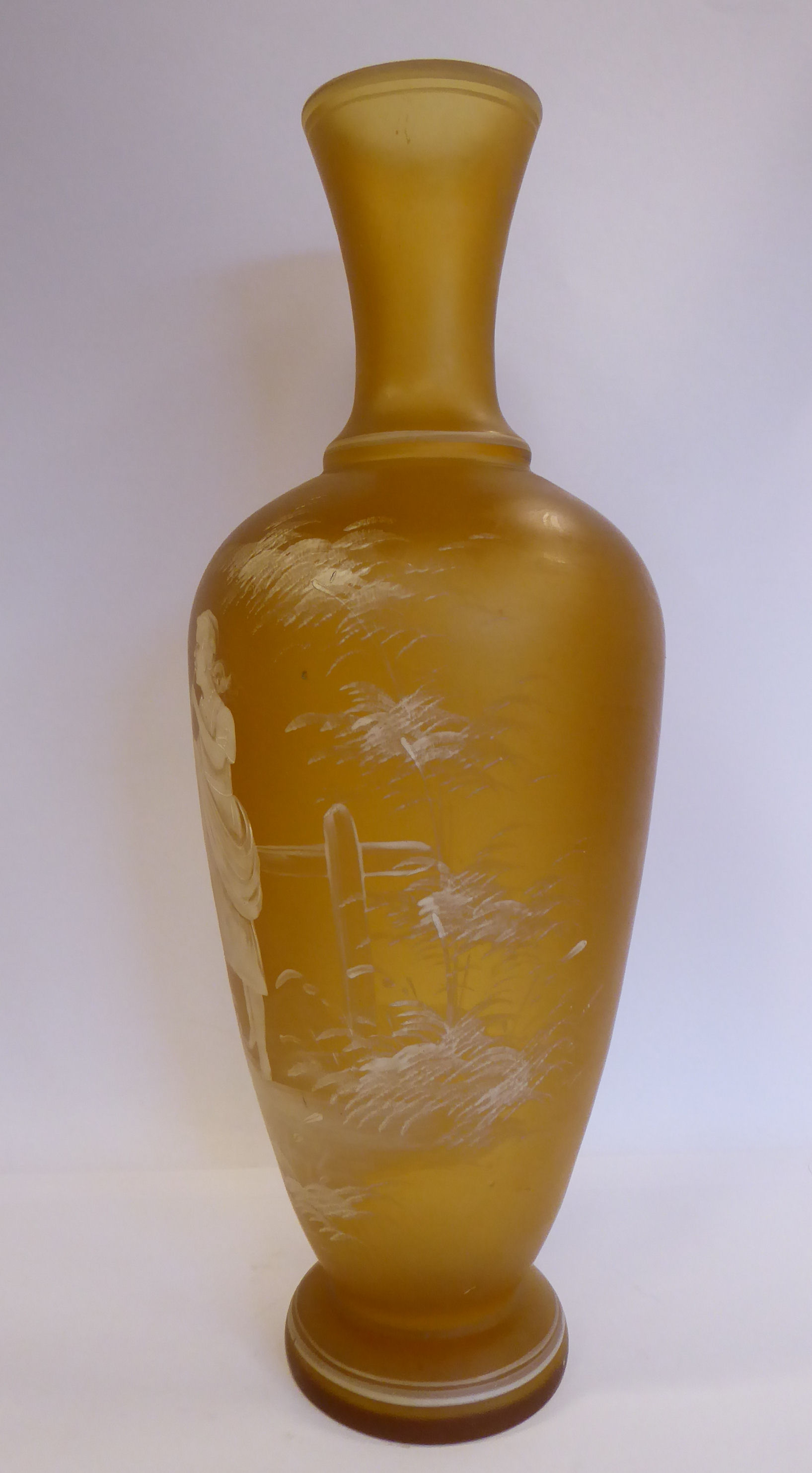 In the manner of Mary Gregory - a semi-opaque amber coloured glass vase of baluster form with a - Image 2 of 6