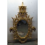 A modern Chinese Chippendale design oval mirror,