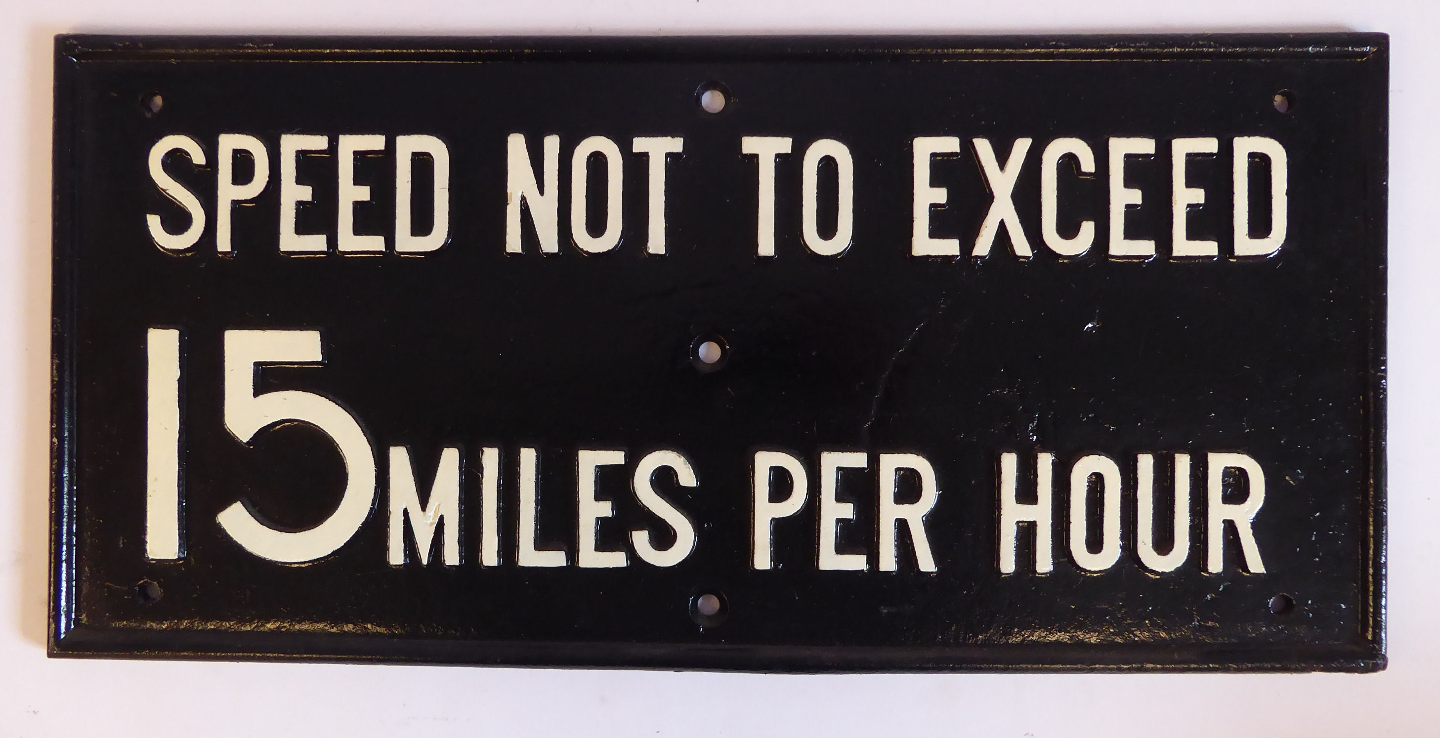 A cast iron white on black railway sign 'Speed Not To Exceed 15 miles per hour' 8'' x 17'' (from