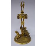 A mid/late 19thC gilt metal table centrepiece, featuring two cherubic figures at play with a goat,