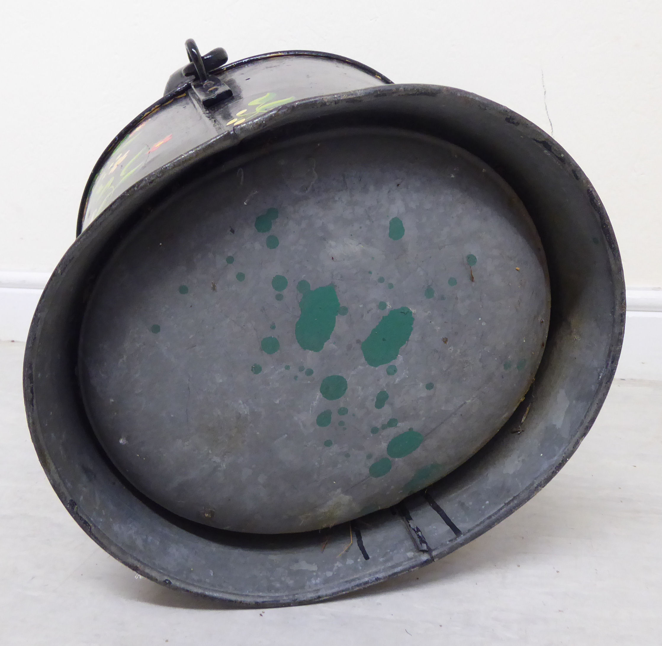 A late 19th/early 20thC Toleware bucket of tapered and waisted oval form with a rivetted fixed and - Image 6 of 6