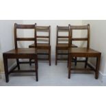 A set of four early 19thC country made oak framed chairs with horizontal bar crests and splats,