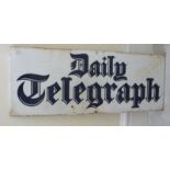 An enamelled steel, black on white advertising sign 'Daily Telegraph' 9'' x 19.