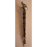 A silver coloured metal torah pointer (or Yad), the finial featuring a standing lion,