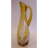 In manner of Mary Gregory - a tined amber coloured glass jug of tapered form with a drawn loop