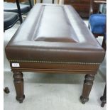 A modern Victorian style long stool, the stitched and stud upholstered brown hide top,