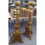 A pair of modern 19thC Continental style, foliate moulded and gilded pedestals,