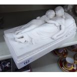 A late 19thC Mintons Parianware group, two girls asleep on a daybed bears an impressed mark 9.