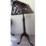 A mid Victorian style burr walnut and mahogany finished duet music stand with opposing fret carved