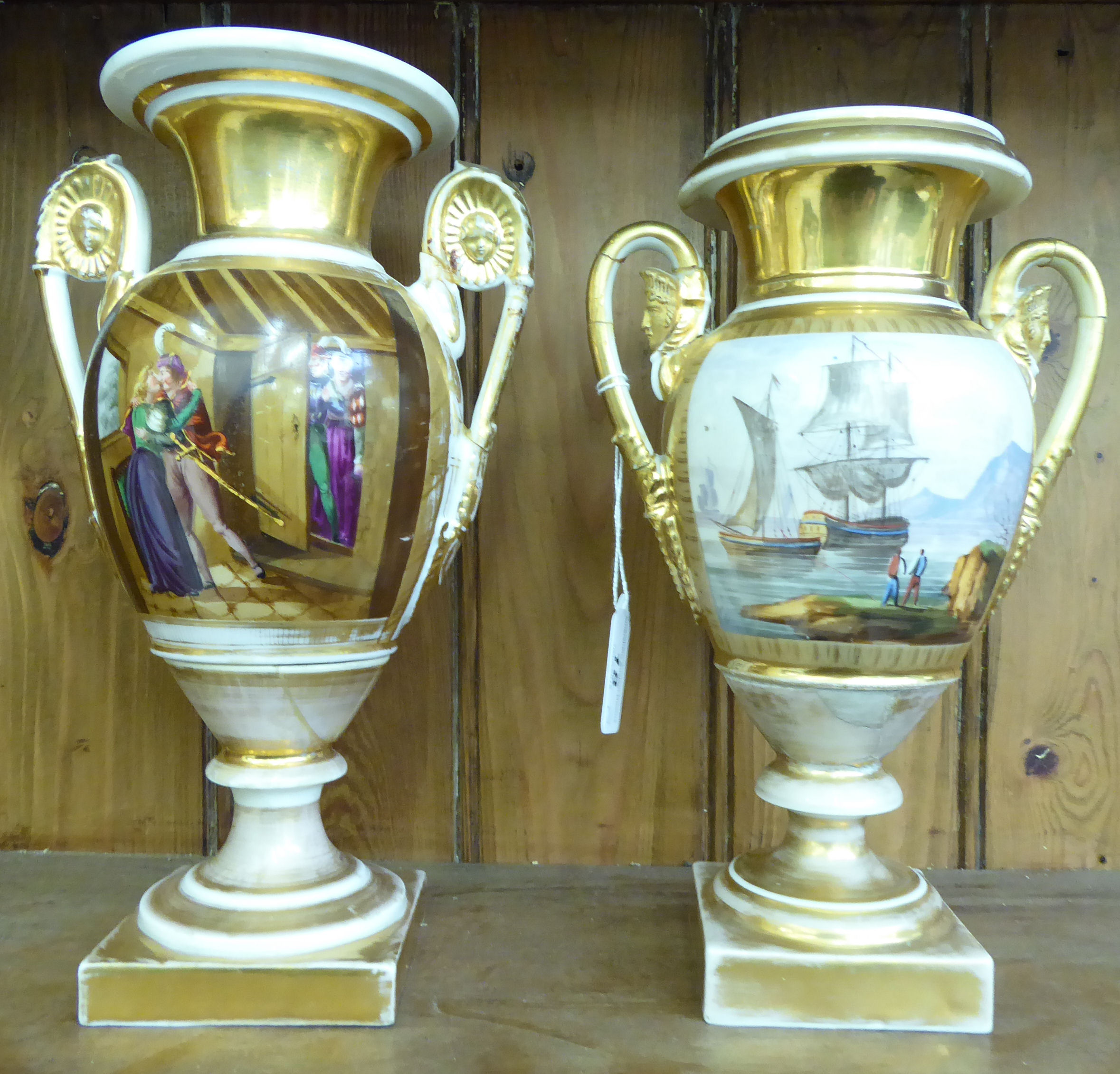 Two similar late 19thC Berlin porcelain twin handled pedestal vases,