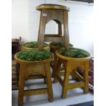 A set of five mid 20thC oak framed bar room stools,