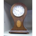 An Edwardian string inlaid mahogany cased mantel clock;