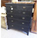 An early 20thC black painted pine dressing chest with two short/four graduated long drawers,