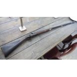 A late 19thC pinfire rifle with a brass bound mahogany stock CA