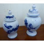 Two similar modern Chinese porcelain baluster shaped vases and covers,