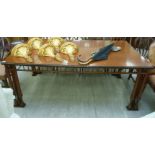 A modern mahogany and black painted dining table,