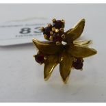 An 18ct gold floral ring,