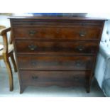 A George III mahogany dressing chest with a brushing slide, over four graduated long drawers,