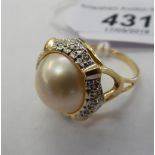 A 14ct gold Mabe pearl and diamond set ring 11