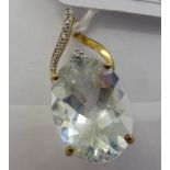 A 9ct gold aquamarine and diamond set pendant 11