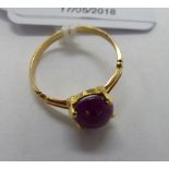 A gold coloured metal ring,