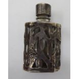 An 'antique' white metal and glass miniature perfume bottle with pierced,