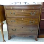 A modern mahogany bachelor's dressing chest with a brushing slide, over three drawers,
