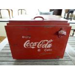 A modern cast metal 'Coca Cola' red painted cool box with a hinged lid 16''h 16''w BSR