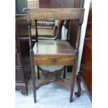 An early 19thC mahogany night stand with two tiers and a single drawer, raised on square,