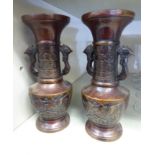 A pair of modern Chinese cast and patinated bronze, twin handled vases,