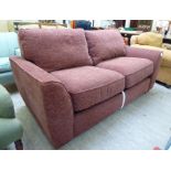 A modern sofa bed, upholstered in textured brown fabric,