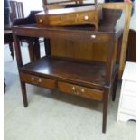 A George III mahogany washstand with an upstand, open shelf and two inlaid drawers,