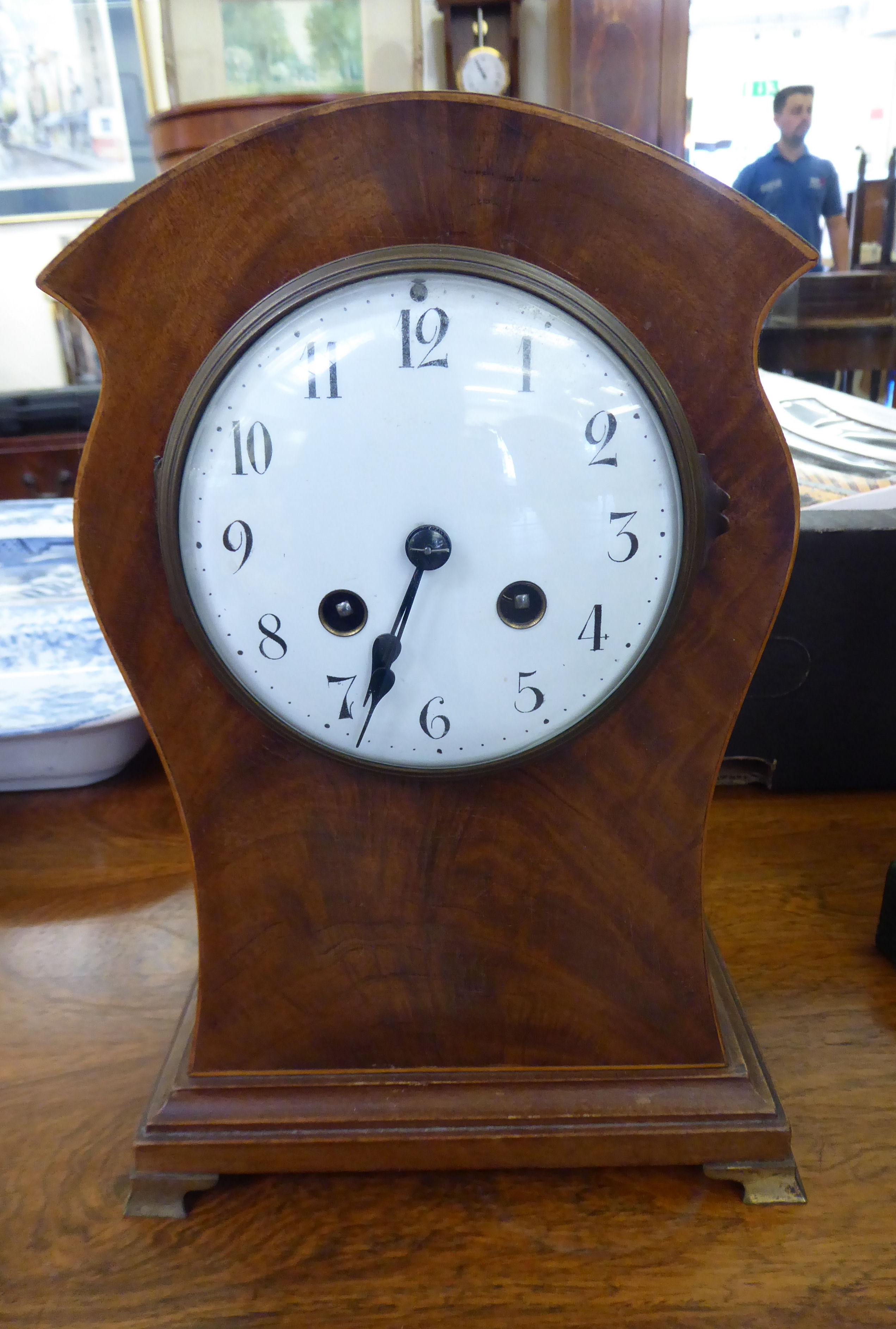 An Edwardian mahogany cased mantel clock;