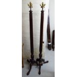 A pair of 1920s/30s mahogany standard lamps with reeded columns,