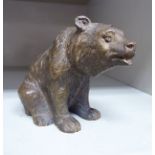 A modern cast bronze model, a seated brown bear 2.