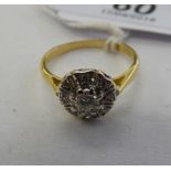 An 18ct gold diamond cluster ring 11