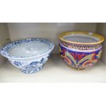 Two jardiniere pots, one porcelain, decorated blue and white 15''dia; and another, pottery example,