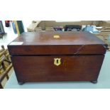An early 19thC mahogany tea caddy with a hinged lid and straight sides,